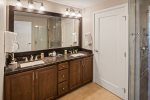 Master bath has double vanity, heated floors, large shower and toilet.
